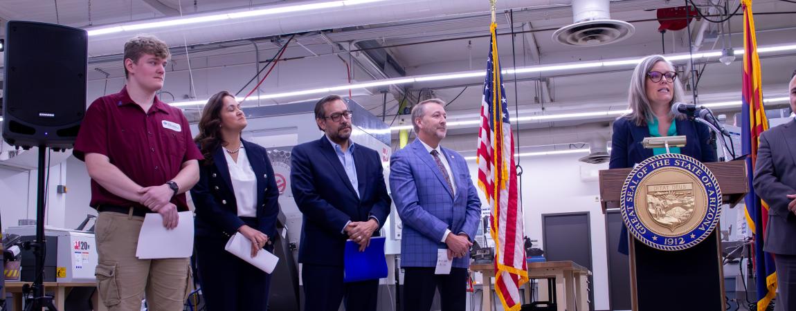 Governor Katie Hobbs speaking in fabrication facility alongside select employees.