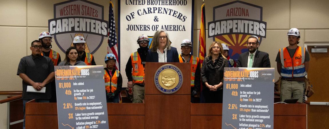Governor Katie Hobbs giving a speech at the United Brotherhood of Carpenters and Joiners of America.