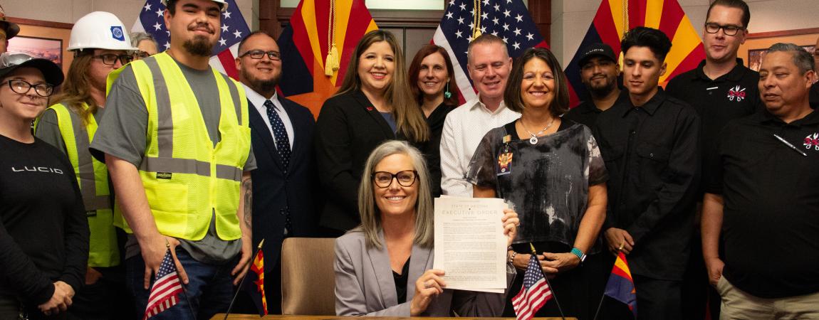 Governor Katie Hobbs presents signed office of strategic initiatives executive order.