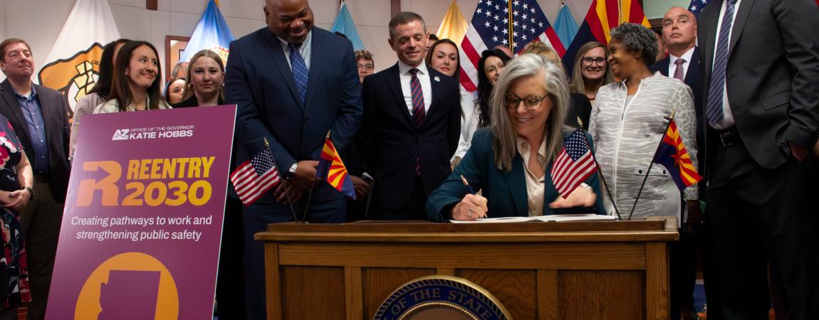 Governor Hobbs signing the Reentry 2030 Executive Order.