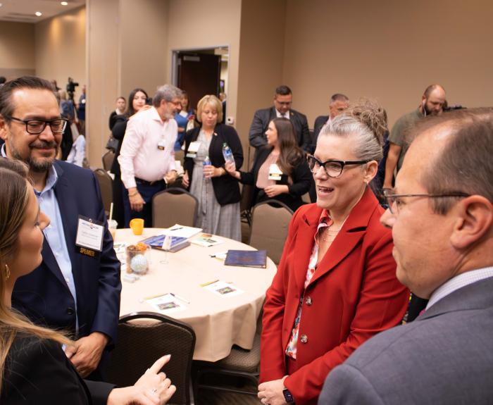 Governor Katie Hobbs conversating during an event.