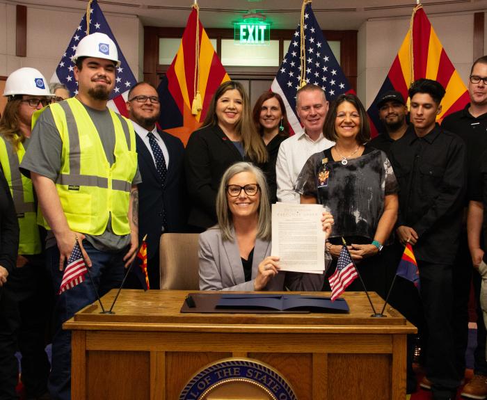 Governor Katie Hobbs presents signed office of strategic initiatives executive order.